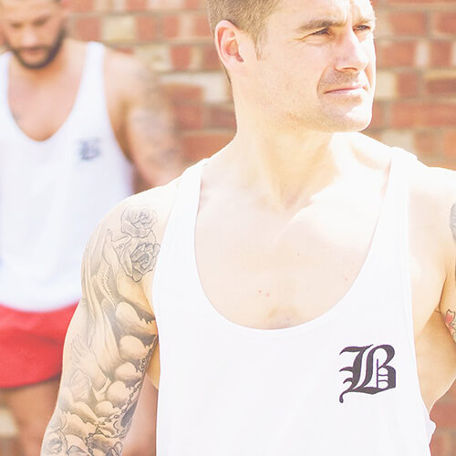 Man in a white Berserker gym vest